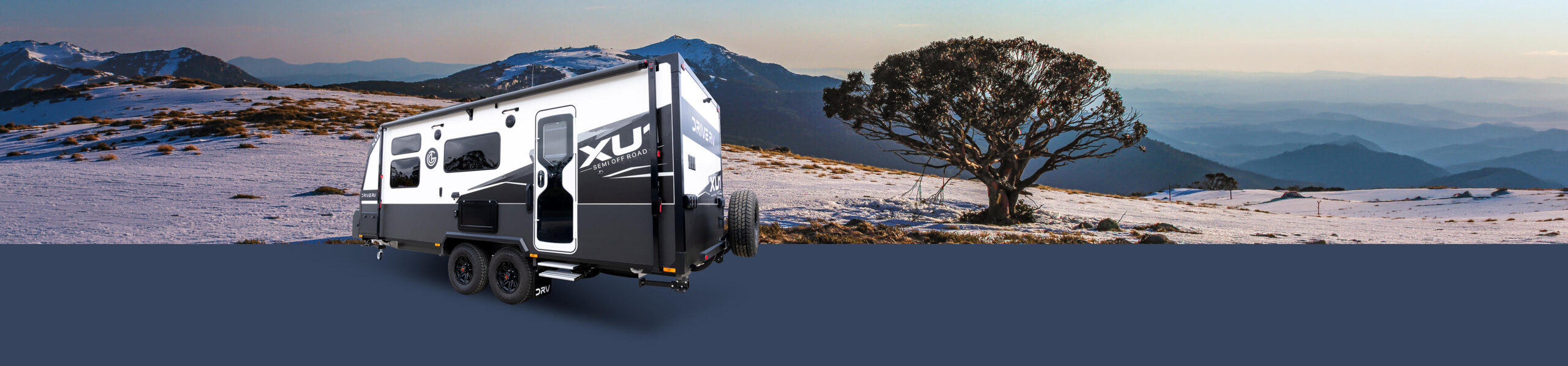 Drive RV XU1 semi off-road caravan in a snowy mountain landscape